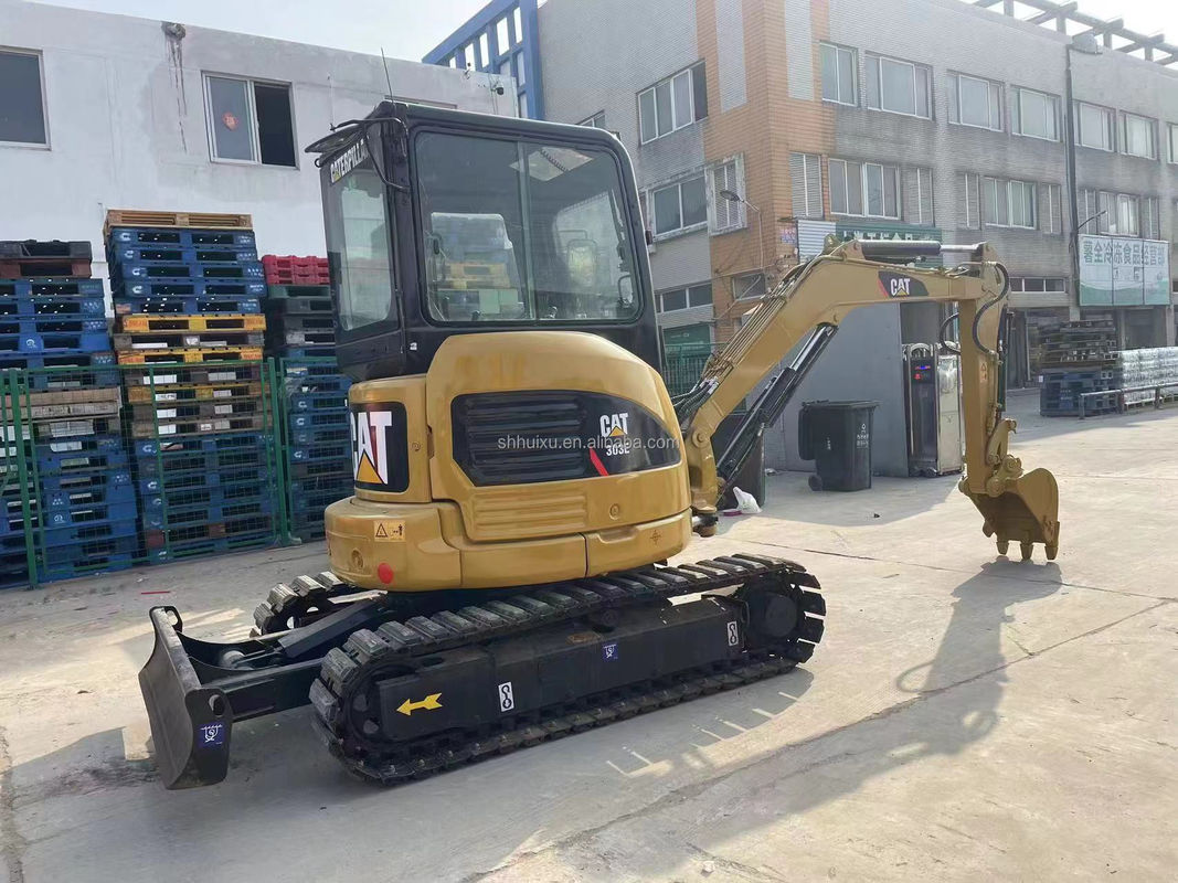 Gelbfarbiger Mini-Gebrauchsgraber Cat303e zum Verkauf